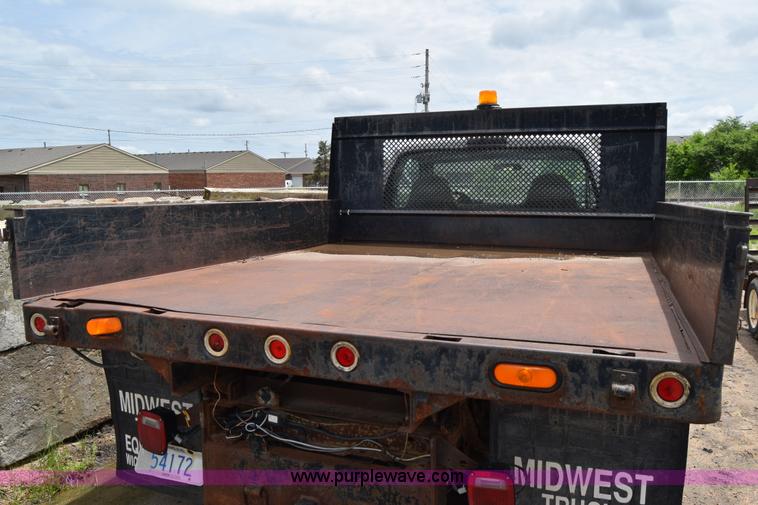 image for item J6638 2001 Ford F350 Super Duty flatbed pickup truck
