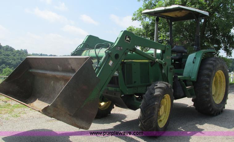 image for item J8533 2000 John Deere 6405 MFWD tractor