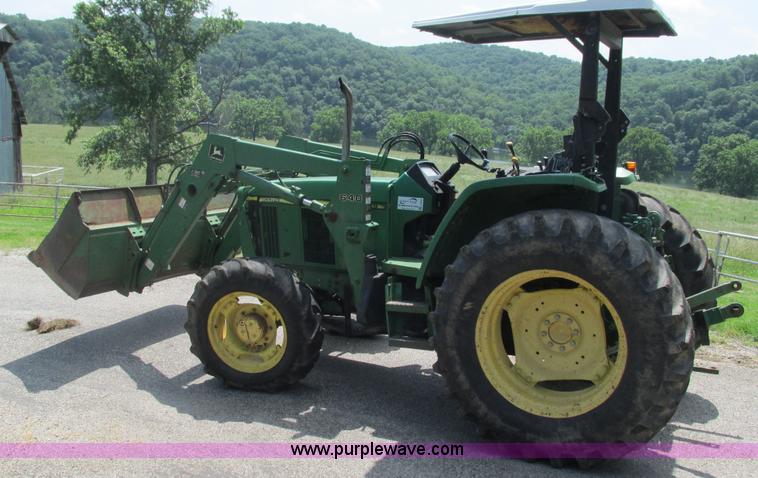 image for item J8533 2000 John Deere 6405 MFWD tractor
