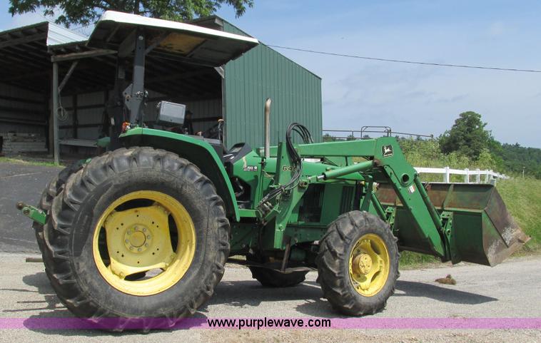 image for item J8533 2000 John Deere 6405 MFWD tractor