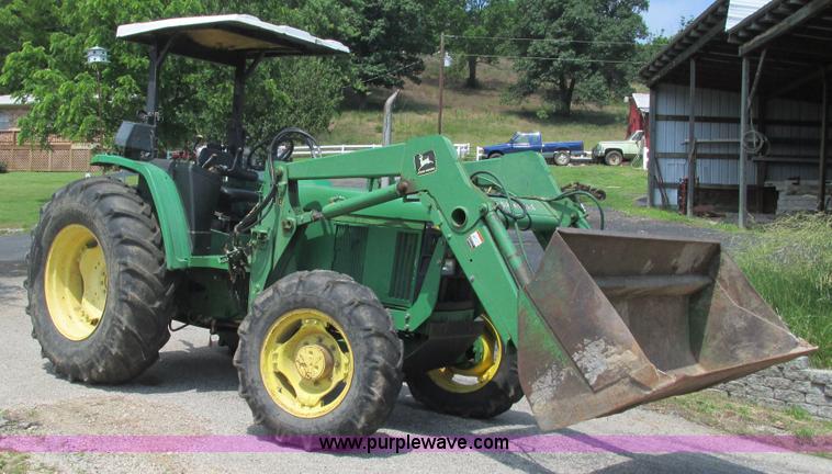 image for item J8533 2000 John Deere 6405 MFWD tractor