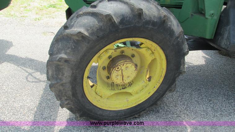 image for item J8533 2000 John Deere 6405 MFWD tractor