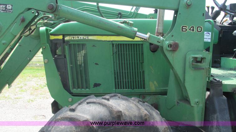 image for item J8533 2000 John Deere 6405 MFWD tractor