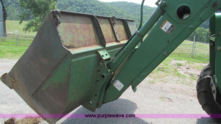 image for item J8533 2000 John Deere 6405 MFWD tractor