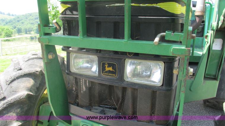 image for item J8533 2000 John Deere 6405 MFWD tractor