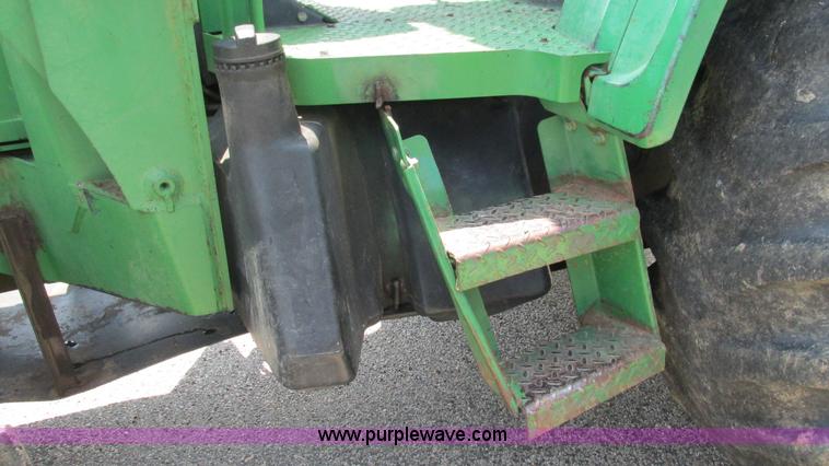 image for item J8533 2000 John Deere 6405 MFWD tractor