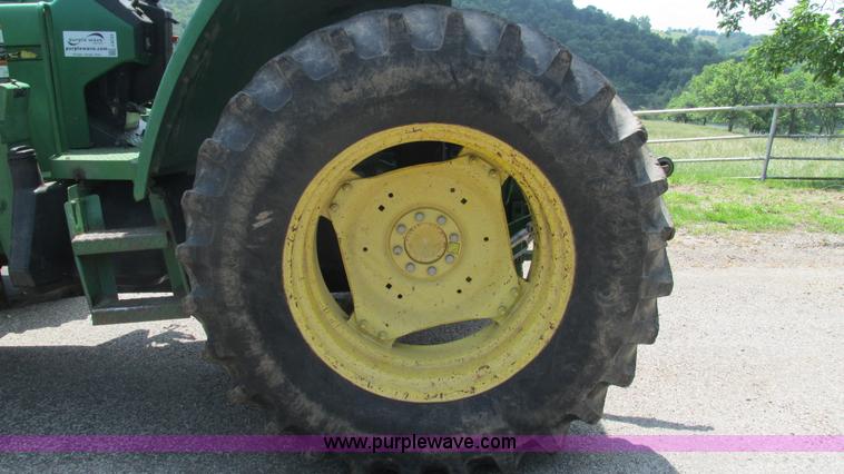 image for item J8533 2000 John Deere 6405 MFWD tractor