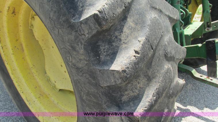 image for item J8533 2000 John Deere 6405 MFWD tractor