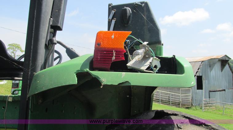 image for item J8533 2000 John Deere 6405 MFWD tractor