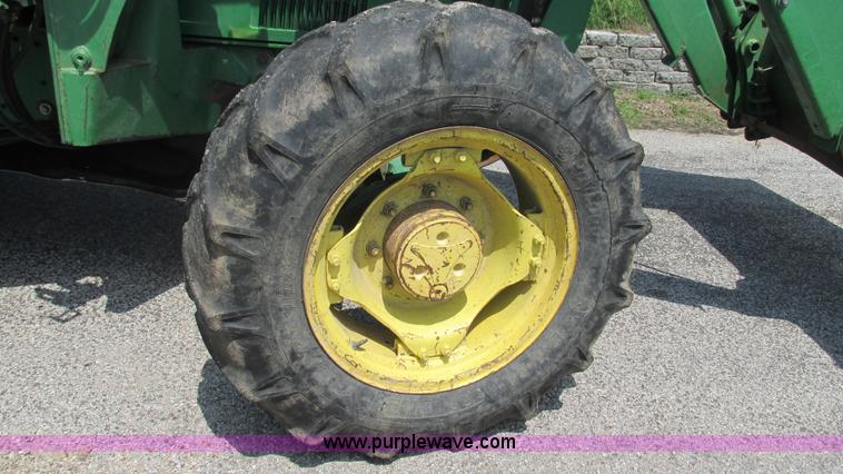 image for item J8533 2000 John Deere 6405 MFWD tractor