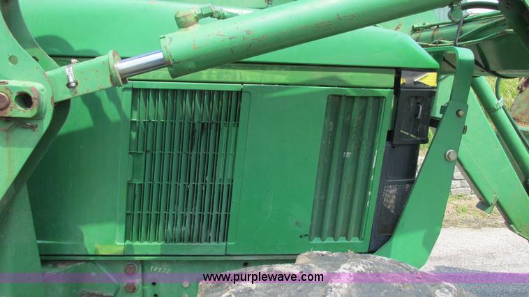 image for item J8533 2000 John Deere 6405 MFWD tractor