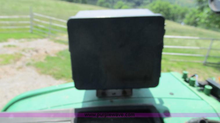 image for item J8533 2000 John Deere 6405 MFWD tractor