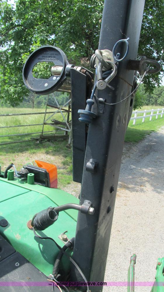 image for item J8533 2000 John Deere 6405 MFWD tractor