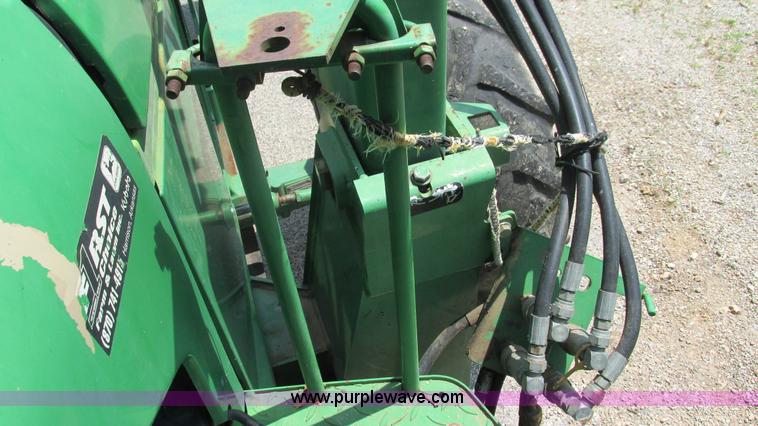 image for item J8533 2000 John Deere 6405 MFWD tractor