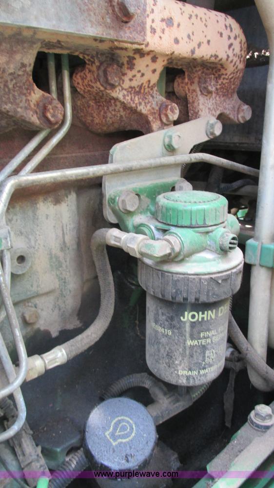 image for item J8533 2000 John Deere 6405 MFWD tractor