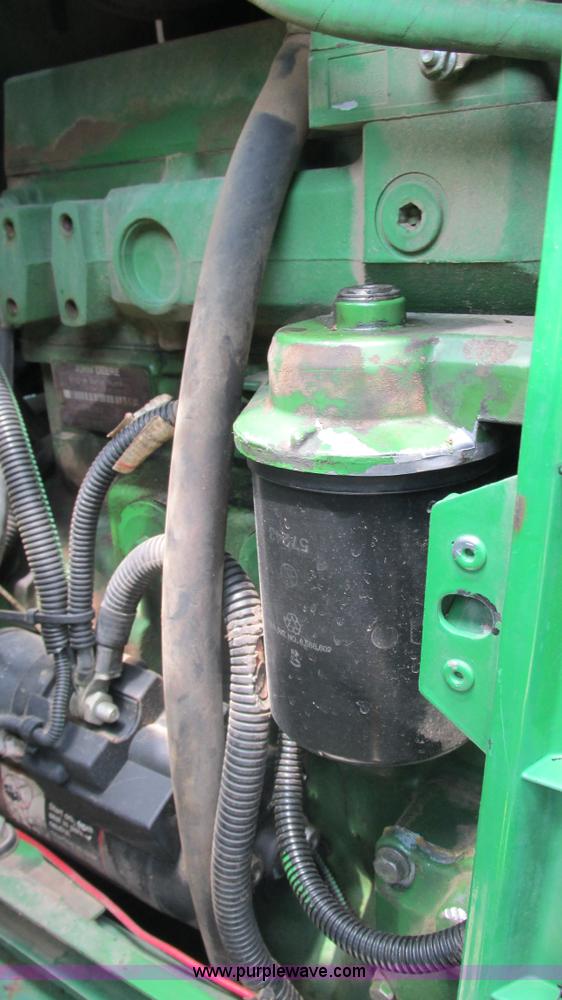 image for item J8533 2000 John Deere 6405 MFWD tractor