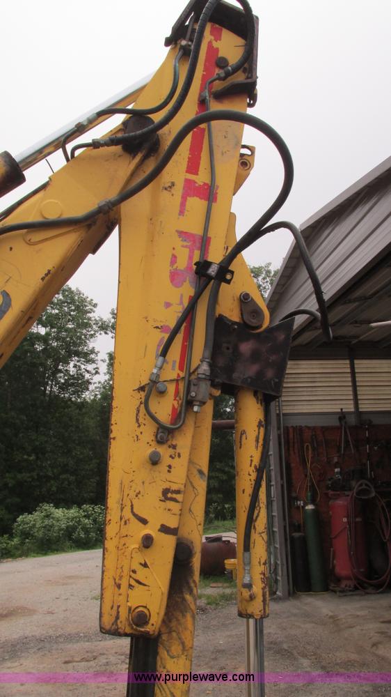 image for item I3054 2000 New Holland LB115 backhoe