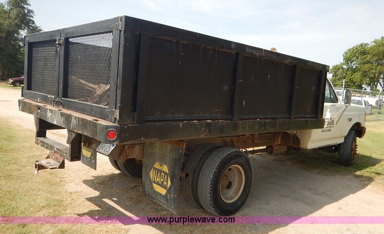 image for item J3860 1991 Ford F450 Super Duty XL flatbed dump truck