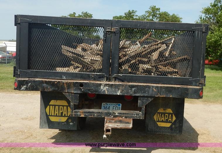 image for item J3860 1991 Ford F450 Super Duty XL flatbed dump truck