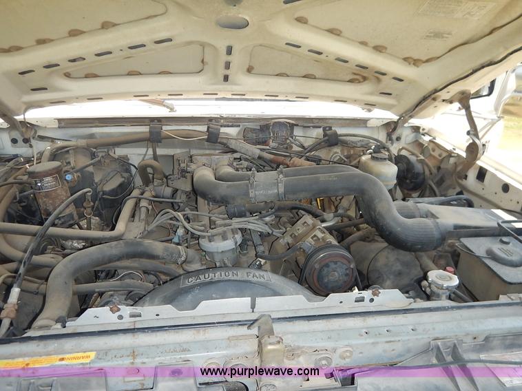 image for item J3860 1991 Ford F450 Super Duty XL flatbed dump truck