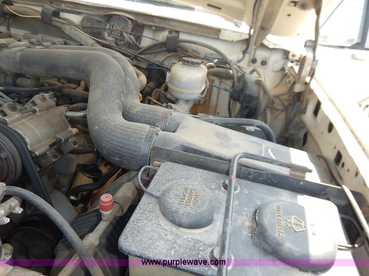 image for item J3860 1991 Ford F450 Super Duty XL flatbed dump truck