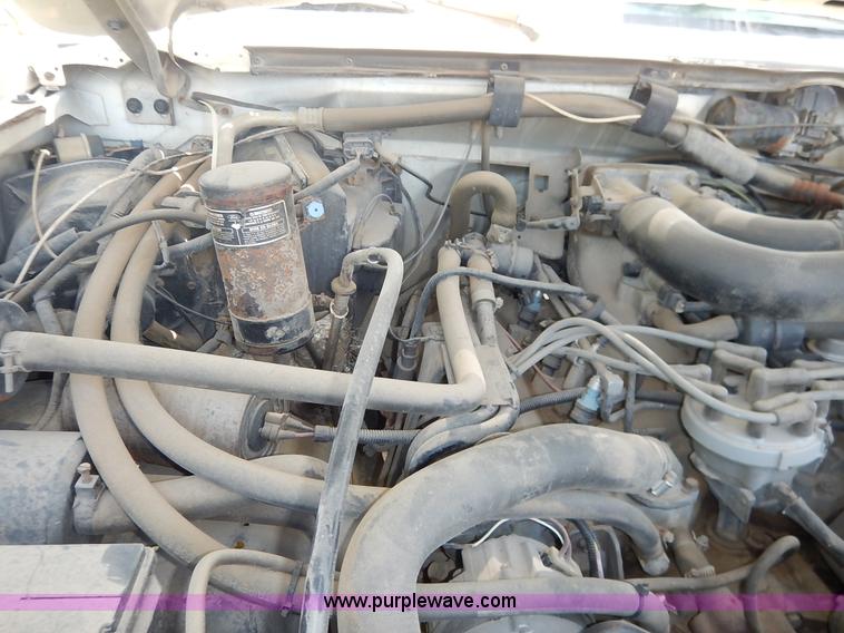 image for item J3860 1991 Ford F450 Super Duty XL flatbed dump truck