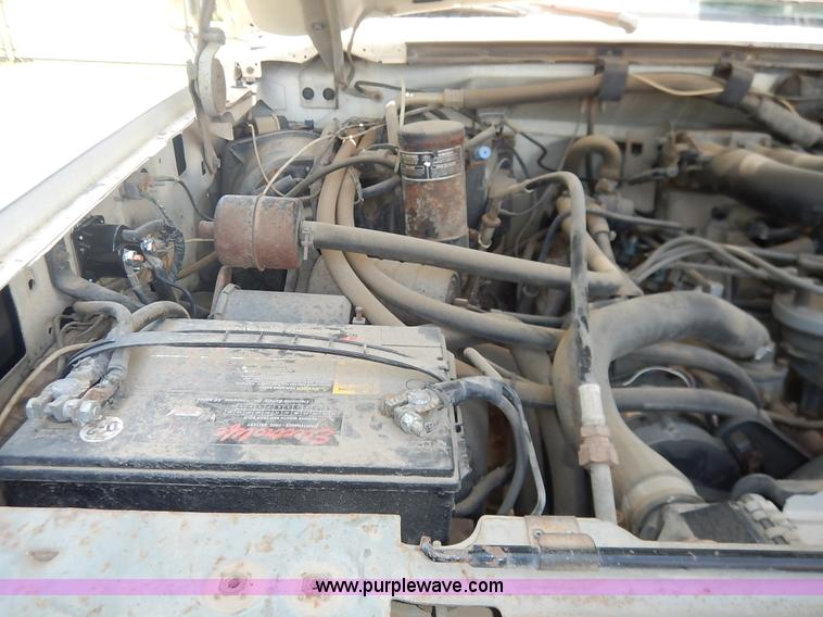 image for item J3860 1991 Ford F450 Super Duty XL flatbed dump truck