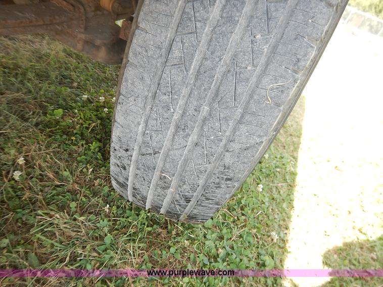 image for item J3860 1991 Ford F450 Super Duty XL flatbed dump truck