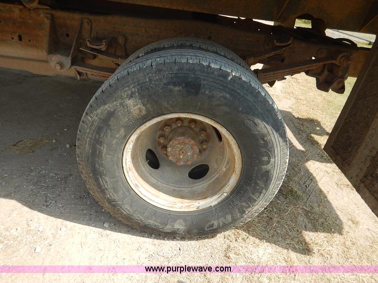 image for item J3860 1991 Ford F450 Super Duty XL flatbed dump truck