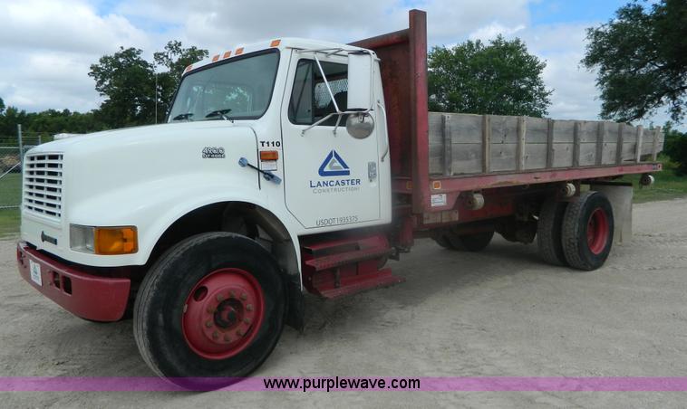 image for item K8102 1999 International 4900 flatbed dump truck