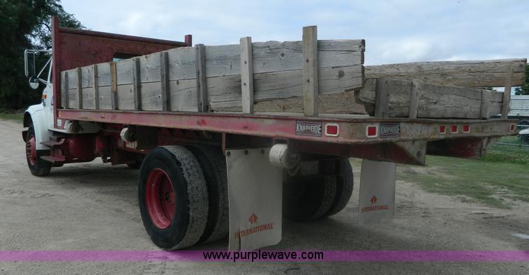 image for item K8102 1999 International 4900 flatbed dump truck