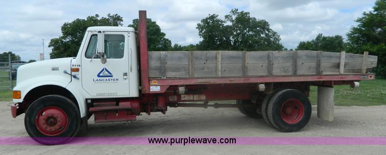 image for item K8102 1999 International 4900 flatbed dump truck