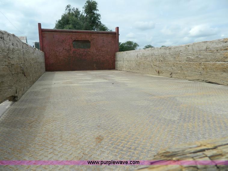 image for item K8102 1999 International 4900 flatbed dump truck