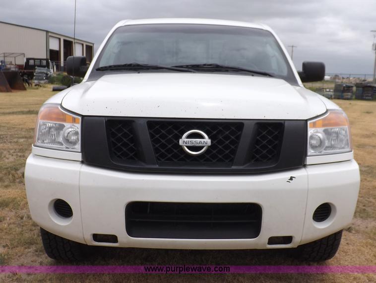 image for item J6951 2011 Nissan Titan S King Cab flatbed pickup truck