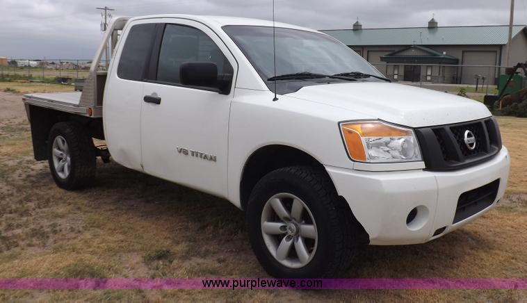 image for item J6951 2011 Nissan Titan S King Cab flatbed pickup truck