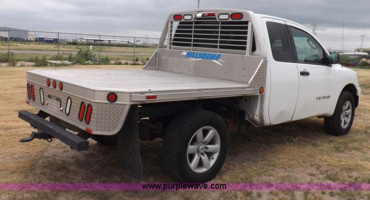 image for item J6951 2011 Nissan Titan S King Cab flatbed pickup truck