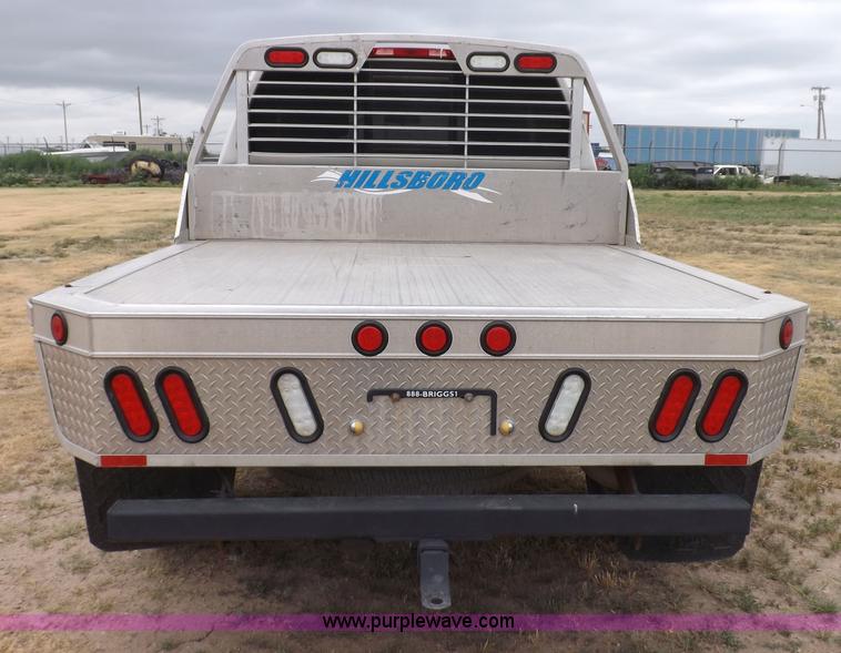 image for item J6951 2011 Nissan Titan S King Cab flatbed pickup truck