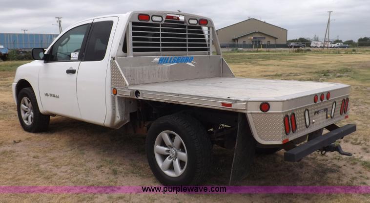 image for item J6951 2011 Nissan Titan S King Cab flatbed pickup truck