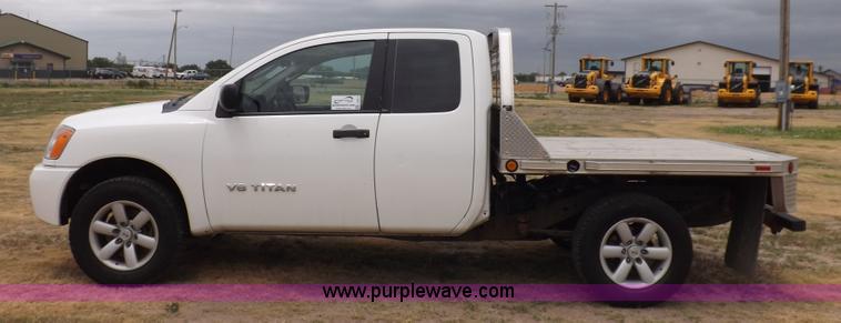 image for item J6951 2011 Nissan Titan S King Cab flatbed pickup truck