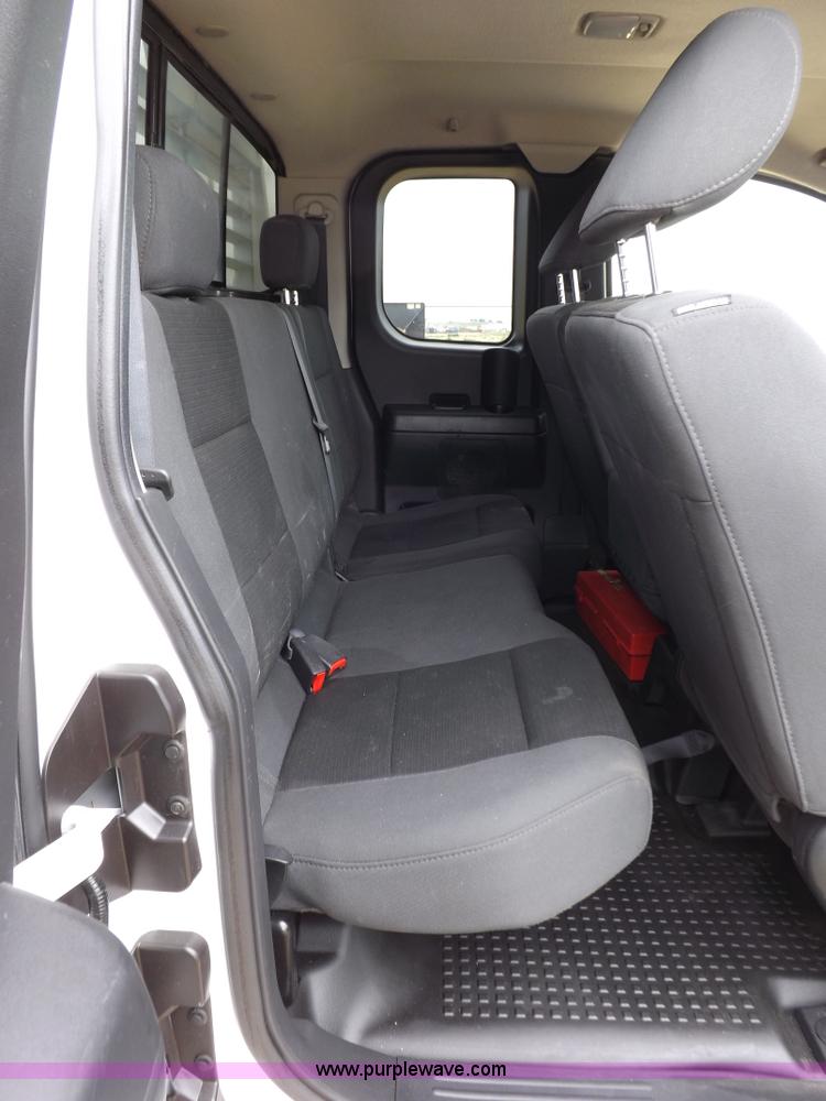 image for item J6951 2011 Nissan Titan S King Cab flatbed pickup truck