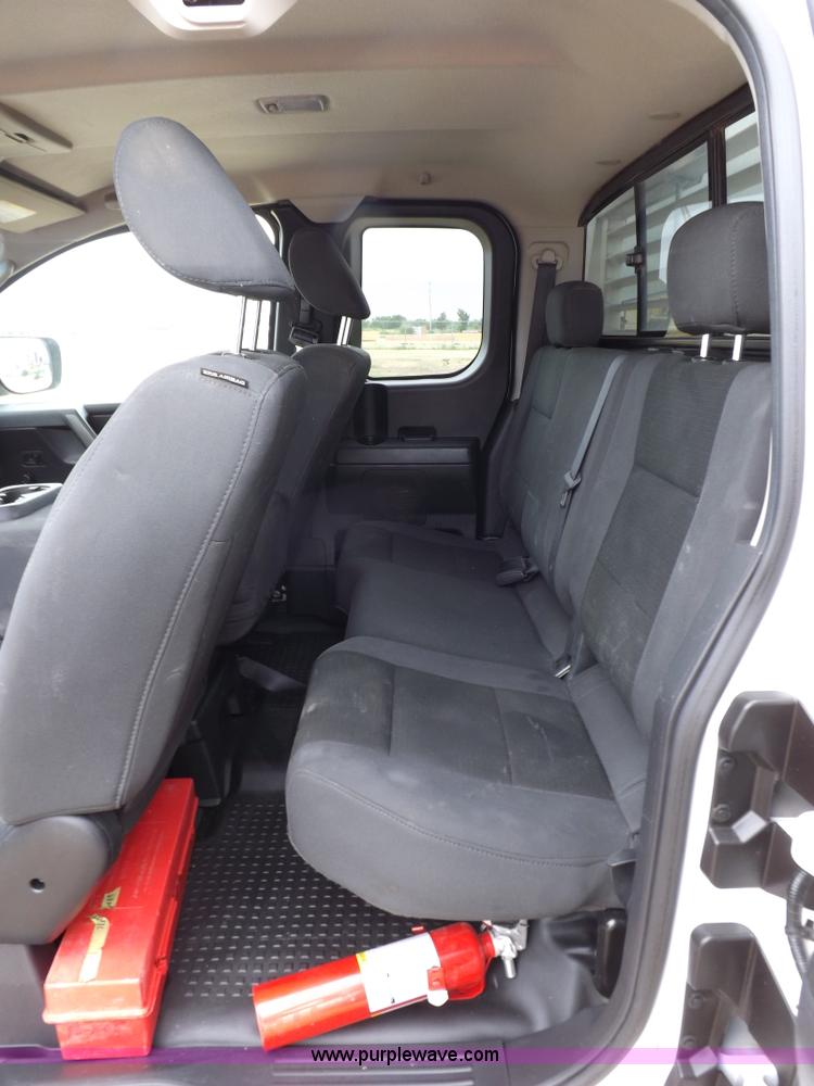 image for item J6951 2011 Nissan Titan S King Cab flatbed pickup truck