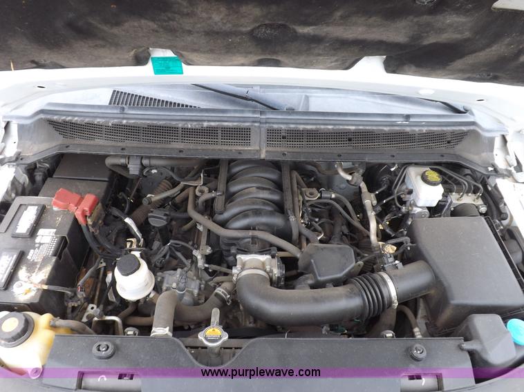 image for item J6951 2011 Nissan Titan S King Cab flatbed pickup truck