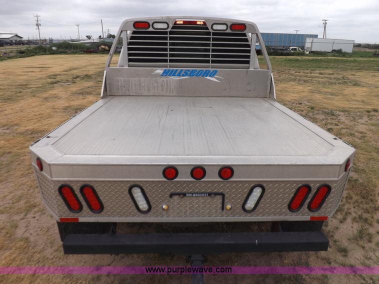 image for item J6951 2011 Nissan Titan S King Cab flatbed pickup truck