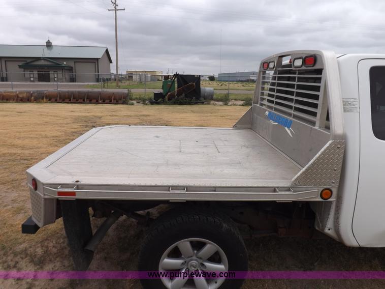 image for item J6951 2011 Nissan Titan S King Cab flatbed pickup truck