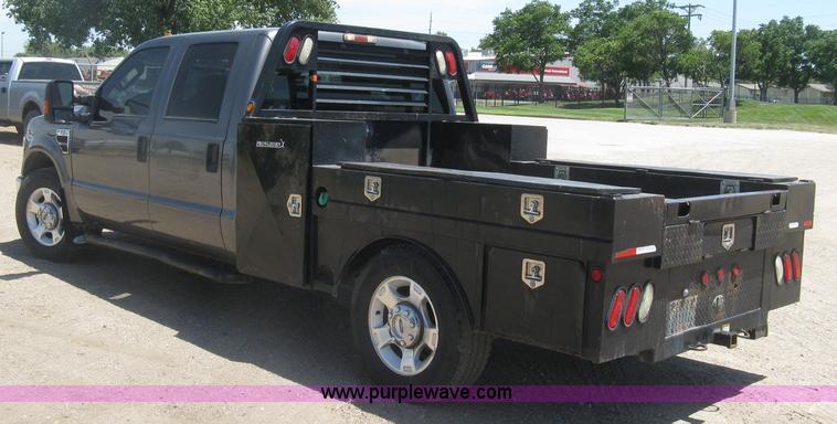 image for item K8652 2010 Ford F350 Super Duty XLT Crew Cab flatbed pickup truck