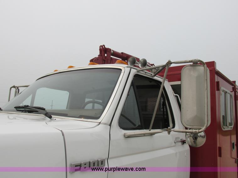 image for item H3268 1991 Ford F800 crane truck with Hi-Rail/Road Rail