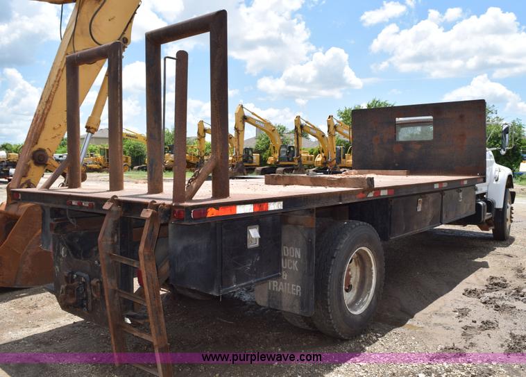 image for item K6053 1999 Ford F700 flatbed truck