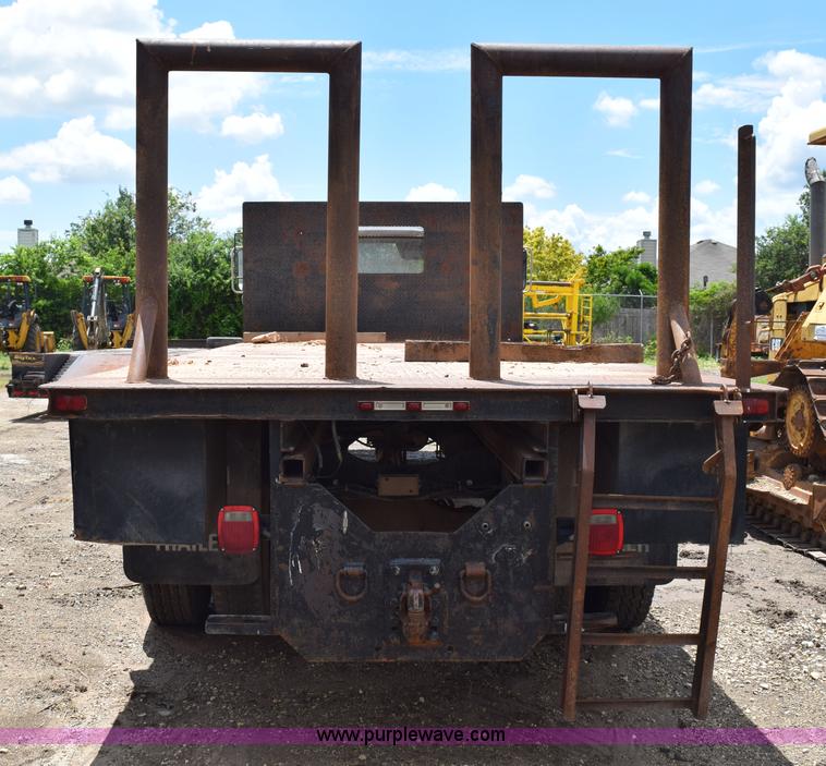 image for item K6053 1999 Ford F700 flatbed truck