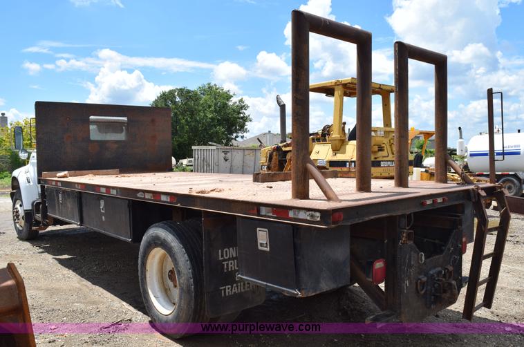 image for item K6053 1999 Ford F700 flatbed truck