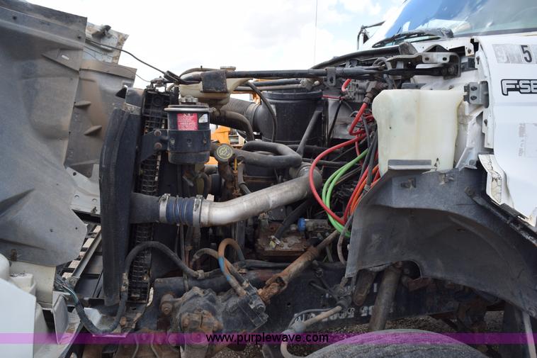 image for item K6053 1999 Ford F700 flatbed truck